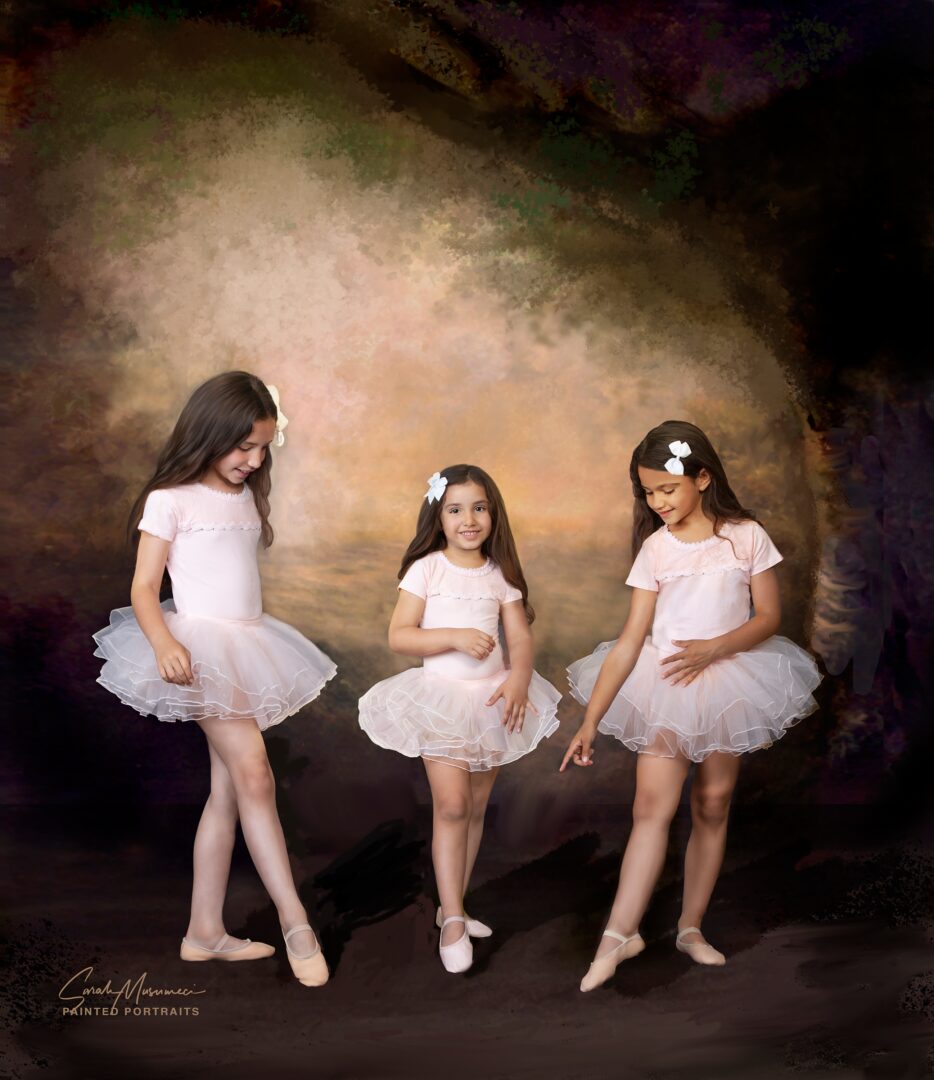Three young ballerinas in pink tutus.
