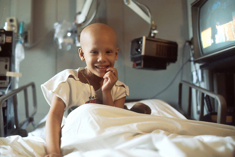A picture of a girl in hospital bed for fund raising